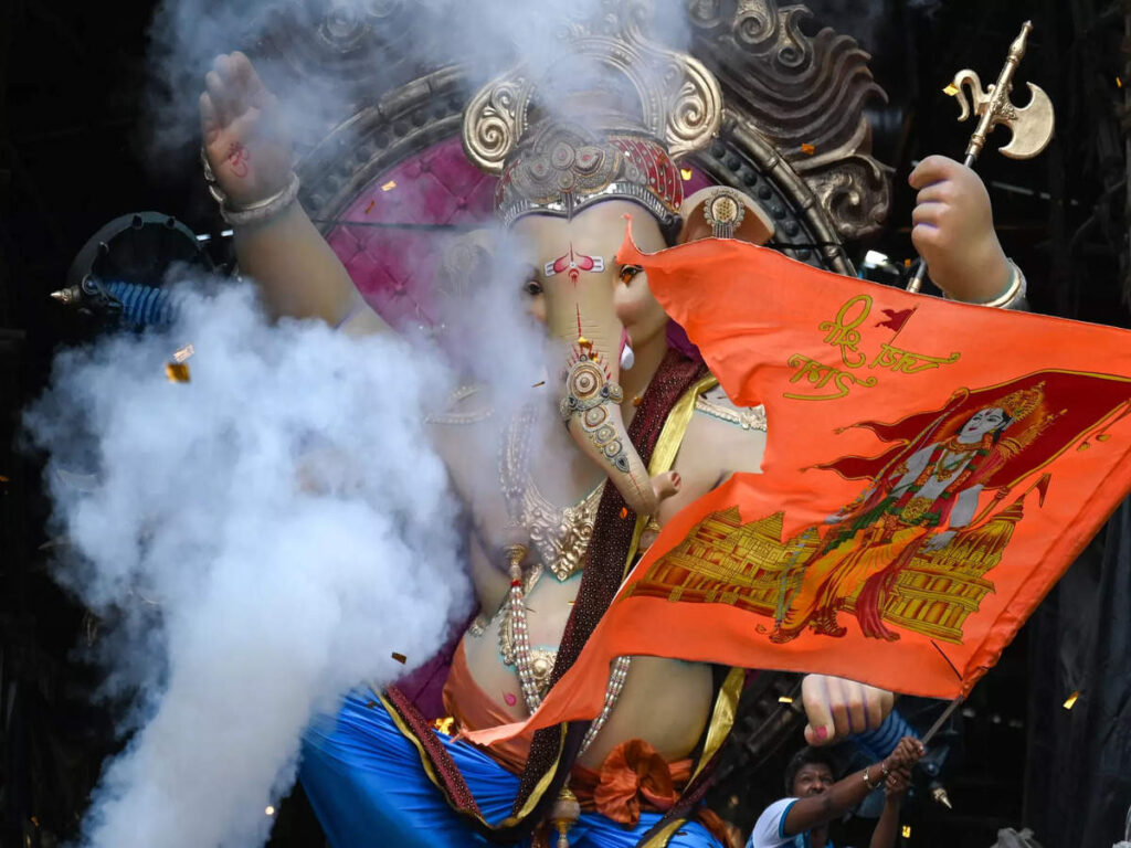 devotees-carry-an-idol-of-the-elephant-headed-hindu-deity-ganesha-during-a-procession-along-a-street-in-mumbai-on-september-17-2023-ahead-of-the-ganesh-chaturthi-festival-