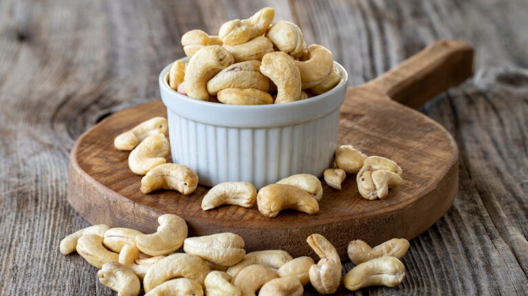 Roasted,Cashews.,Cashew,Nuts,On,Wood,Background.,Bulk,Cashews.,Cashew